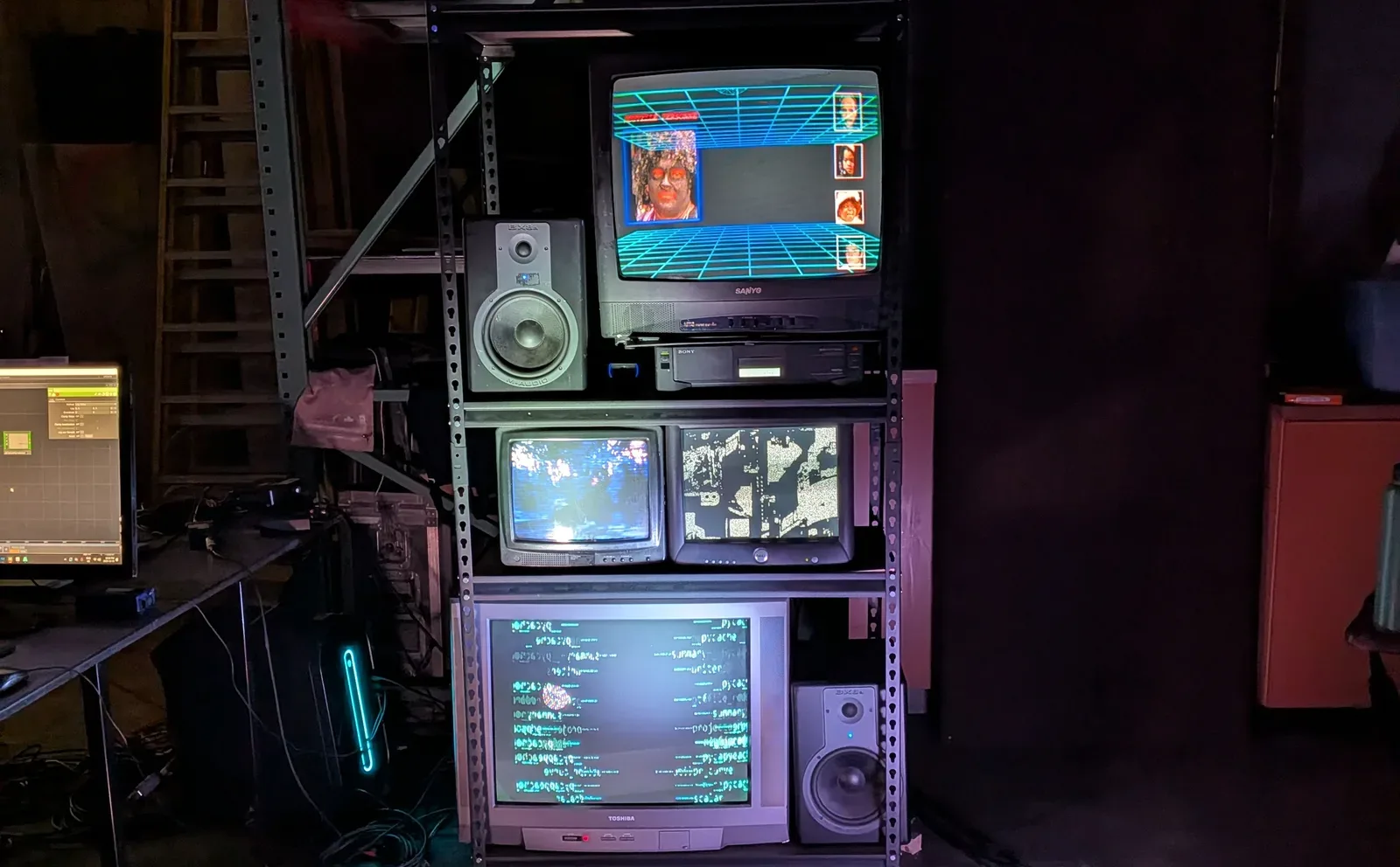 M.O.N.A: a shelf of CRT monitors in the workshop